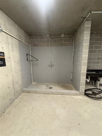 A bathroom under construction with a sign that says